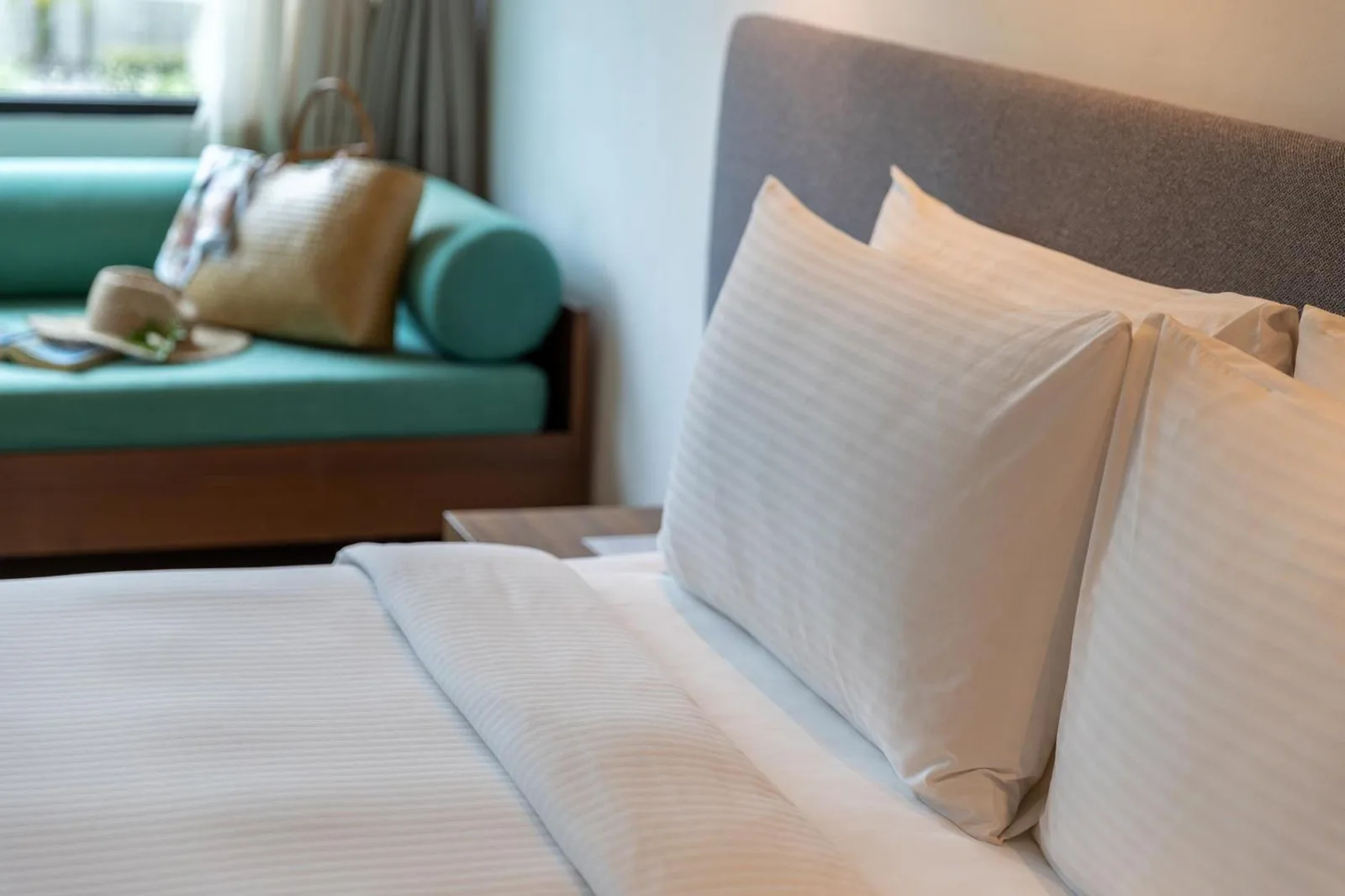 Close-up of bed linens in a guest room at OUTRIGGER Khao Lak Beach Resort in Khao Lak