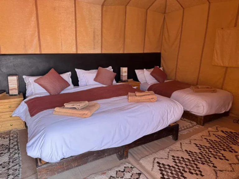 Interior of Overnight Luxury Desert Camp tent with twin beds