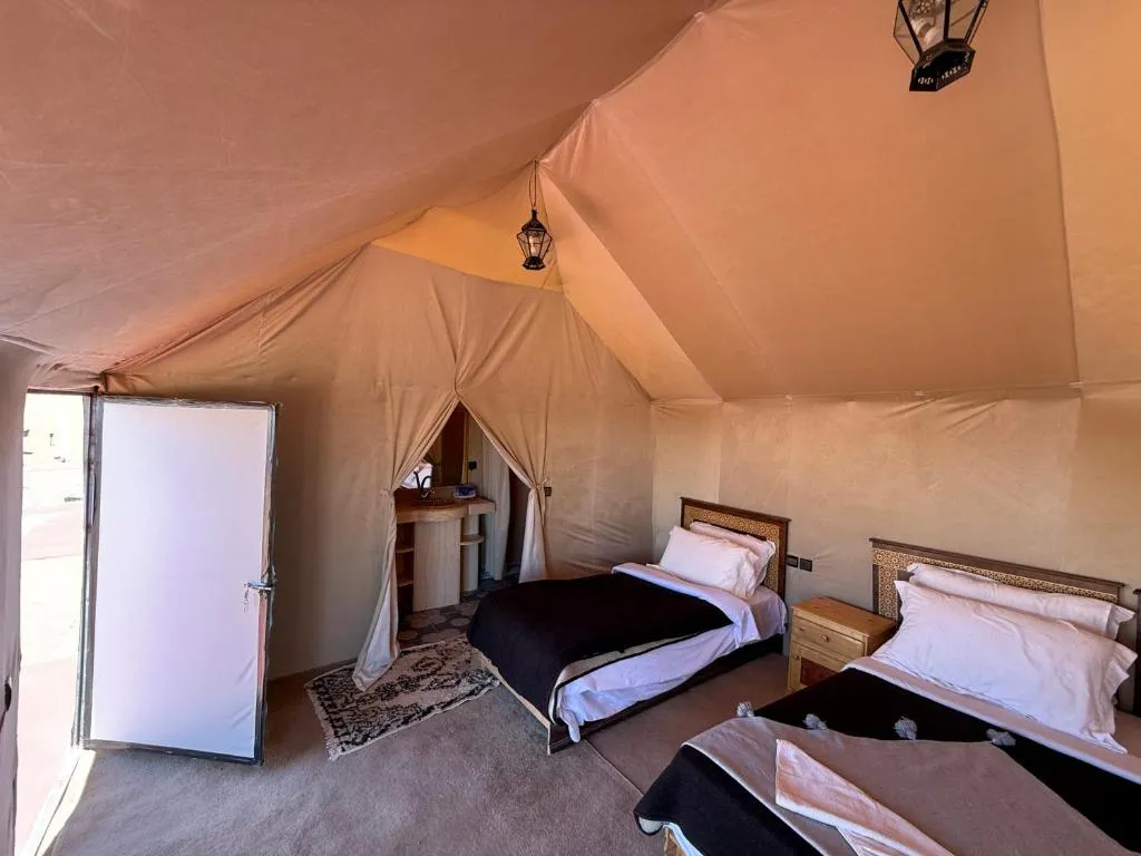 Interior of Overnight Luxury Desert Camp tent with double beds