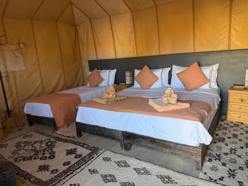 Interior of Overnight Luxury Desert Camp tent with double beds