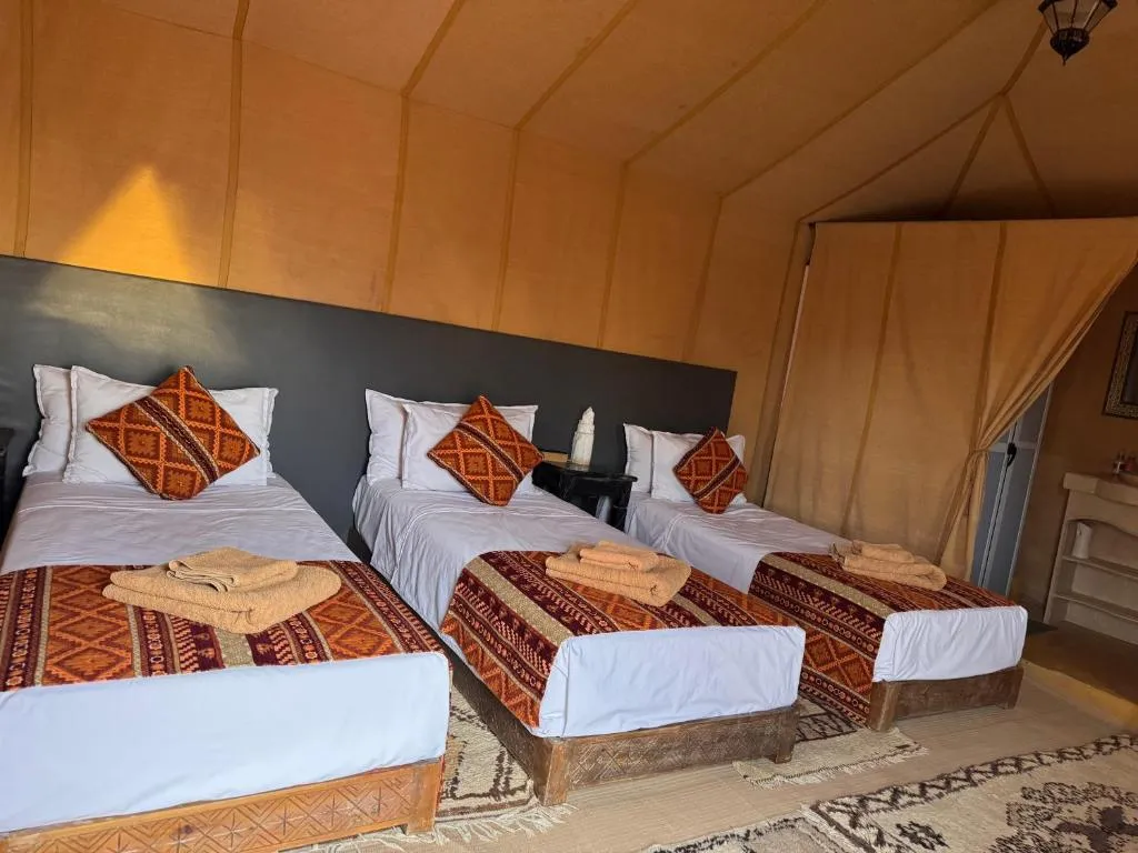 Interior of Overnight Luxury Desert Camp tent with twin beds