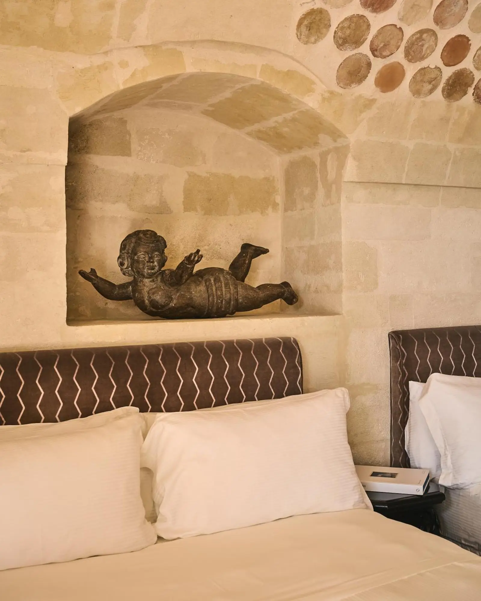 Artistic detail in the room at Palazzo Gattini - The Leading Hotels of the World in Matera