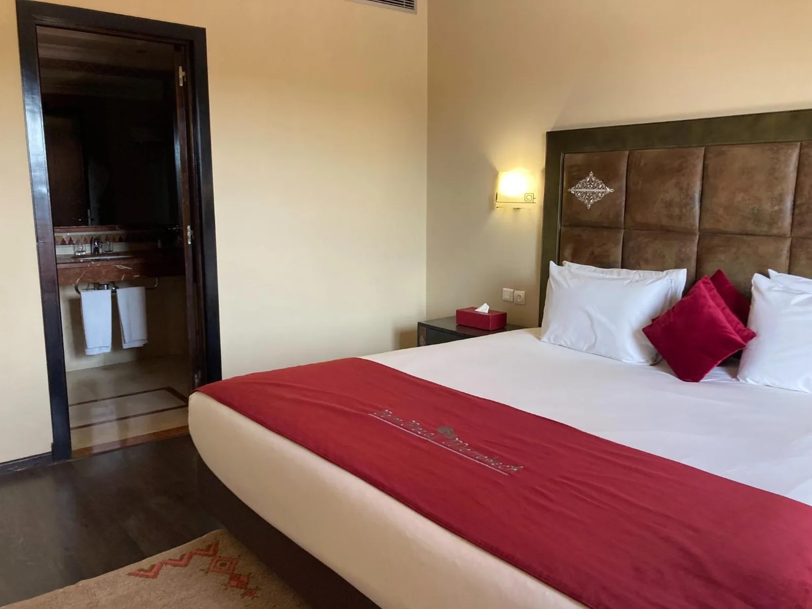 Palm Plaza Marrakech cozy bedroom with red accents
