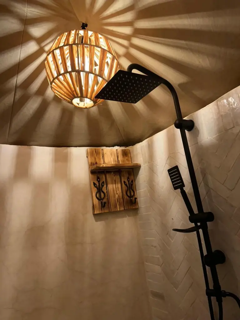 Detail view of the shower area in the luxury tent at Peaceful Luxury Camp in Merzouga