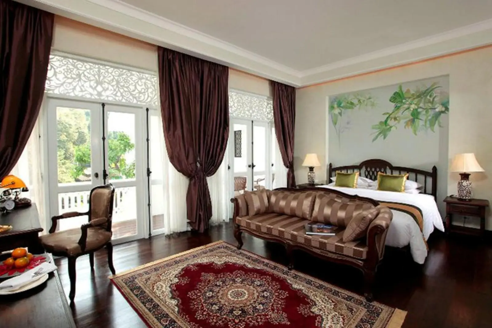 Habitación king de Ping Nakara Boutique Hotel And Spa con área de estar