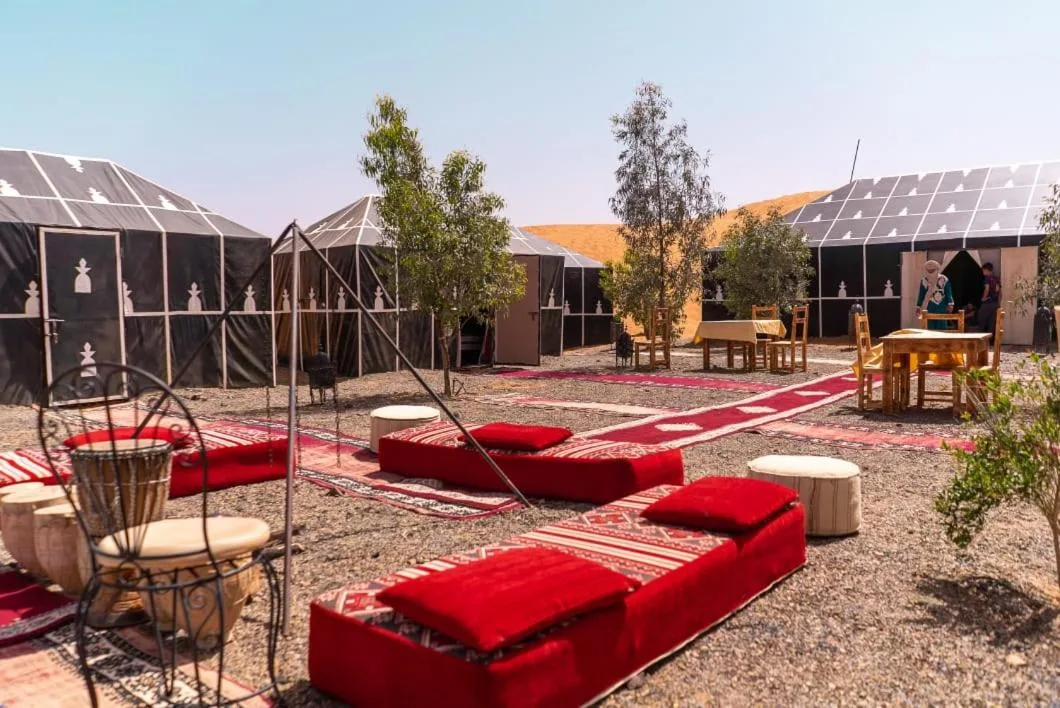 Courtyard seating and lounge area at Planet Sahara Camp in Merzouga