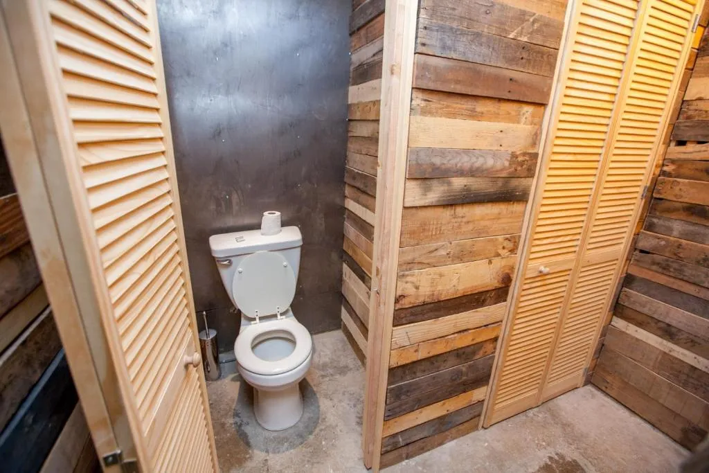 Restroom area in PodShare DTLA with wooden accents