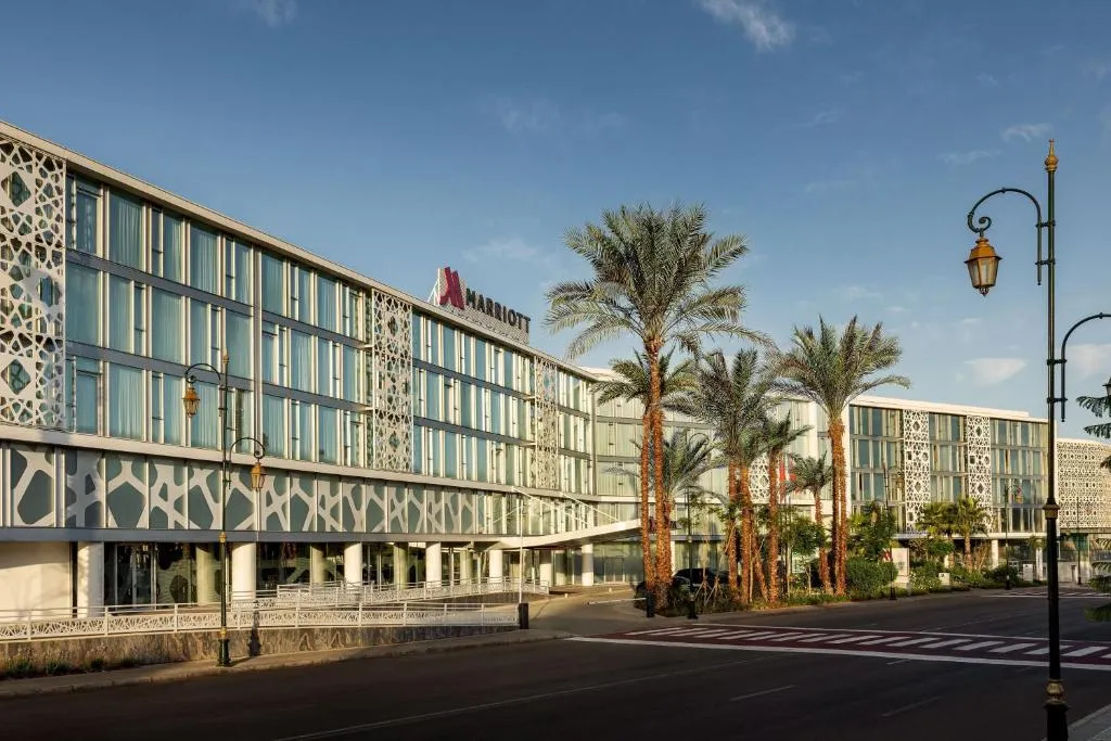 Facade of Rabat Marriott Hotel surrounded by palm trees