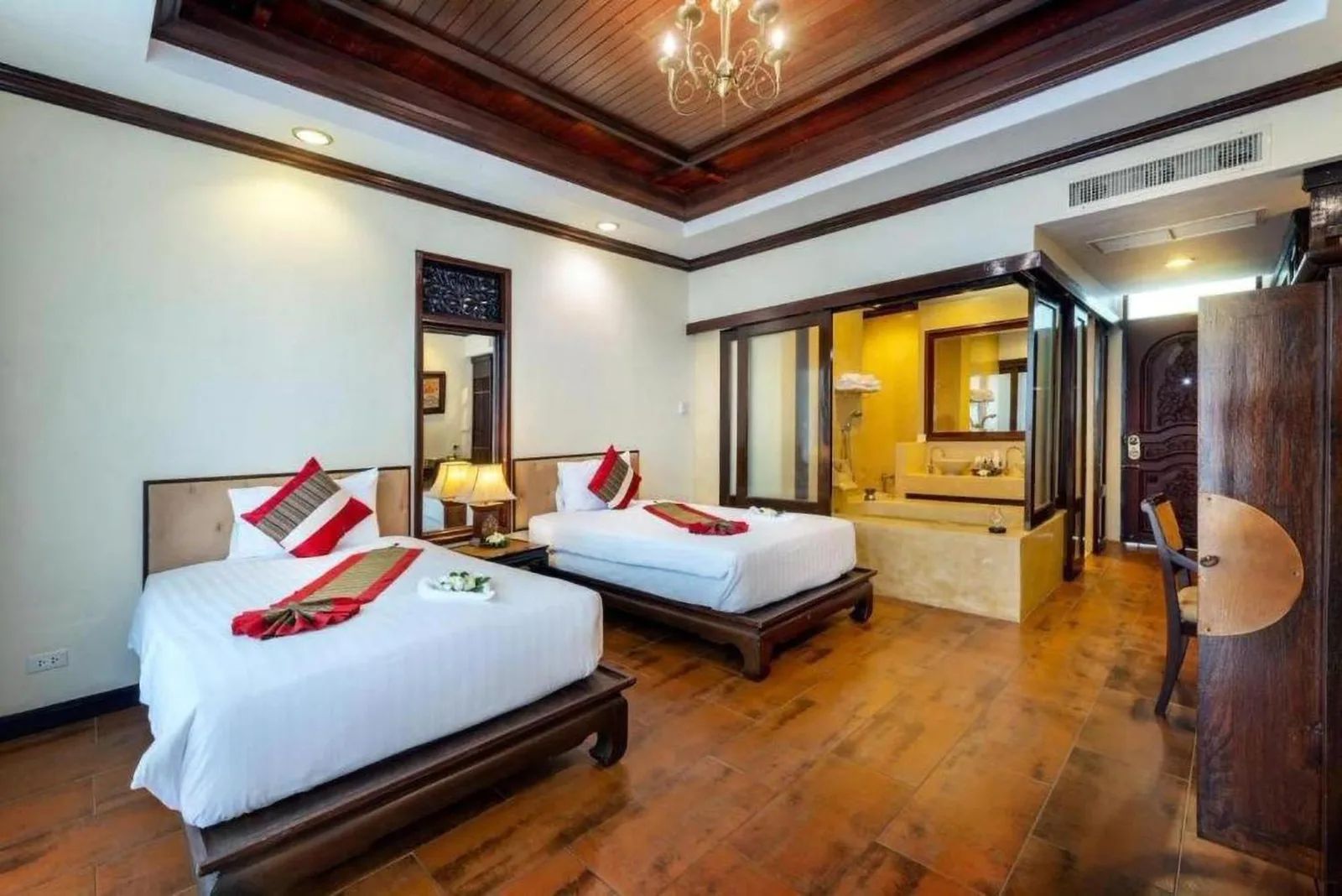 Ocean view bedroom at Racha Kiri Resort & Spa in Khanom, Nakhon Si Thammarat, with a balcony and palm tree outside.
