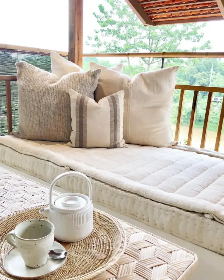 Raya Heritage - SHA Plus – Chiang Mai, Thailand hotel – a couch with pillows and a table on a porch at Raya Heritage - SHA Plus in Chiang Mai