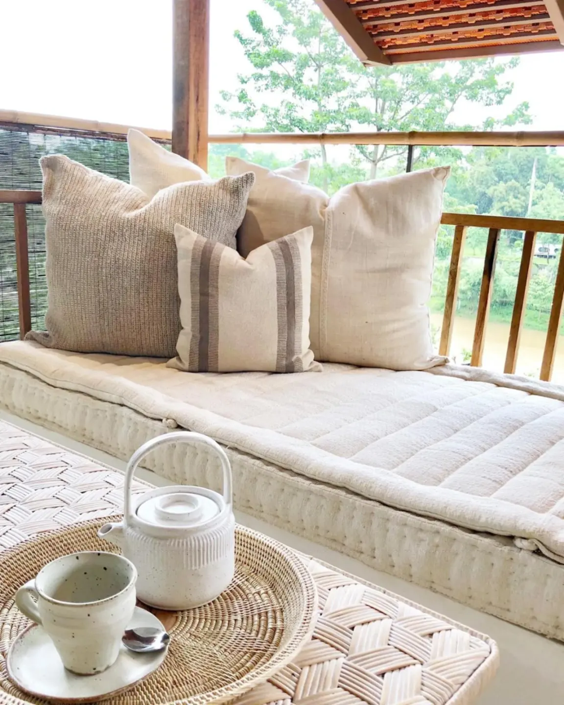 Raya Heritage - SHA Plus – Chiang Mai, Thailand hotel – a couch with pillows and a table on a porch at Raya Heritage - SHA Plus in Chiang Mai