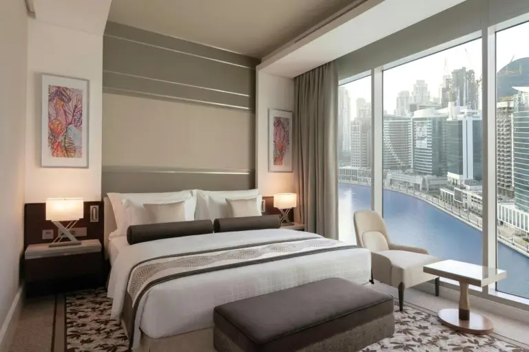 Renaissance Business Bay Hotel elegant bedroom with waterfront view