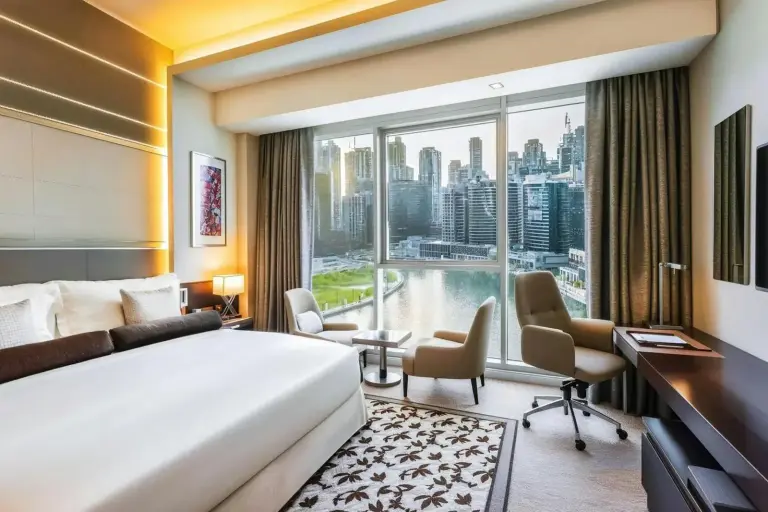 Renaissance Business Bay Hotel luxurious bedroom with city view