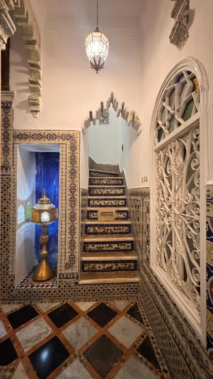Elegant staircase with decorative details at Riad Arous Chamel, Tangier