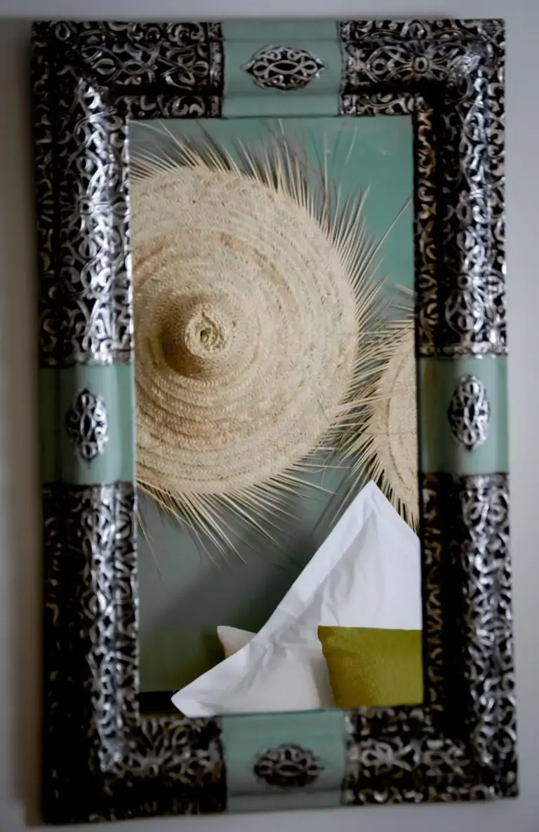Riad FARASHA decorative mirror accentuating the room's style in Marrakech
