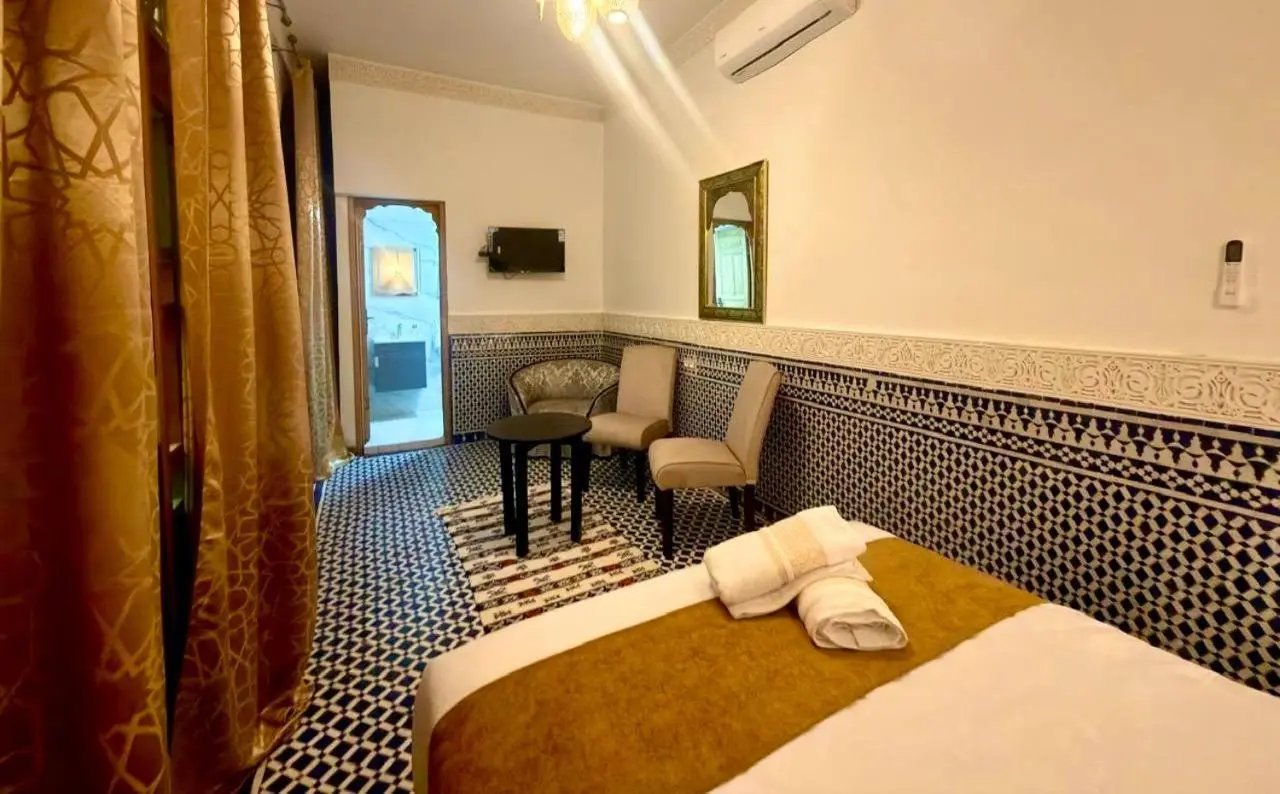 Cozy guest room at Riad Fez in Fes