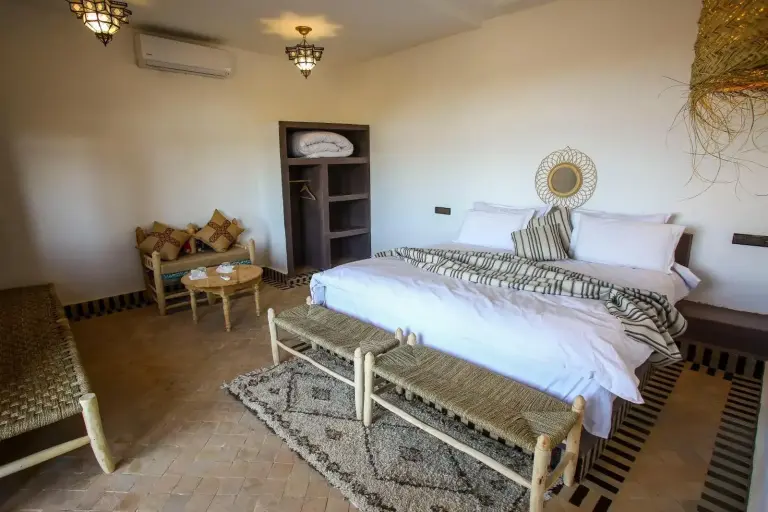 Spacious bedroom layout in Riad Suerteloca Merzouga with modern decor