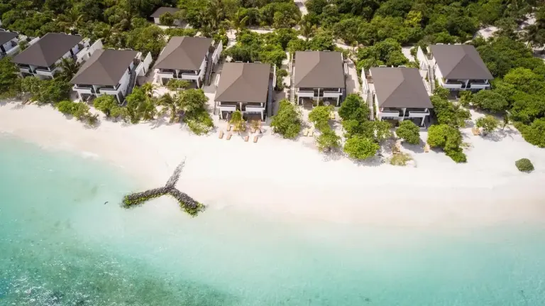 Aerial view of beachfront villas at ROBINSON NOONU