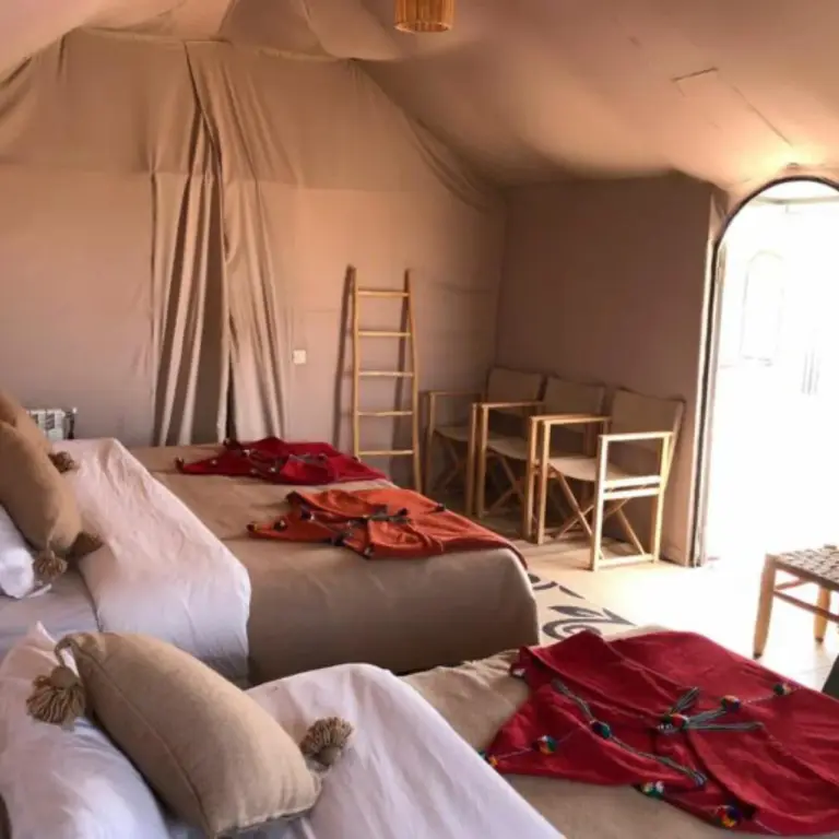 Rosara Luxury Camp in Merzouga view of the Sahara desert through a tent opening