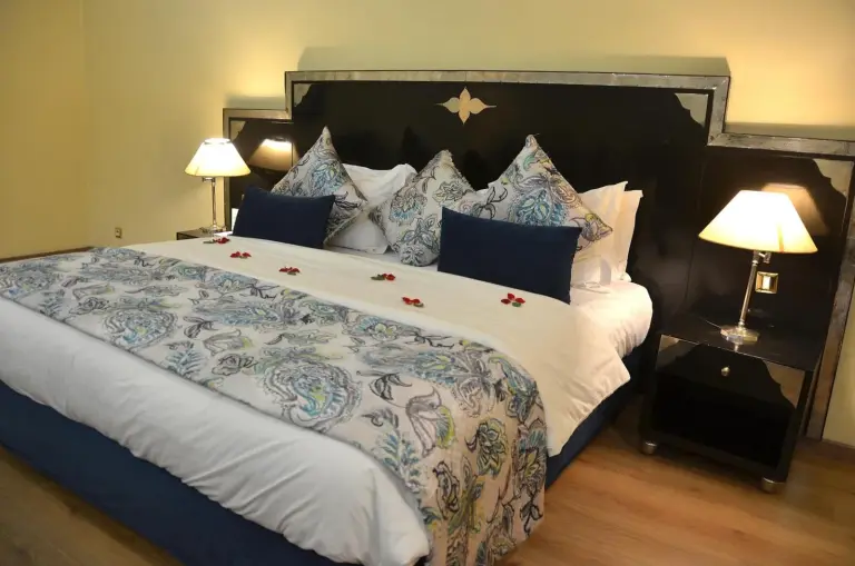 Royal Mirage Deluxe bed with decorative pillows in Marrakech