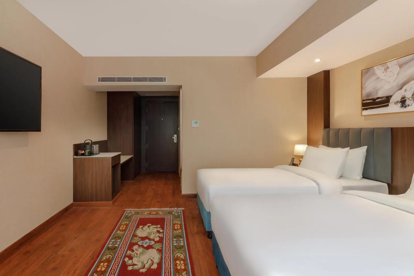 Elegant guest room at Royal Tulip Kathmandu with king bed and bathroom view