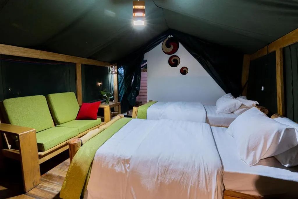 Inside view of a twin room at Ruhondo Island Retreat