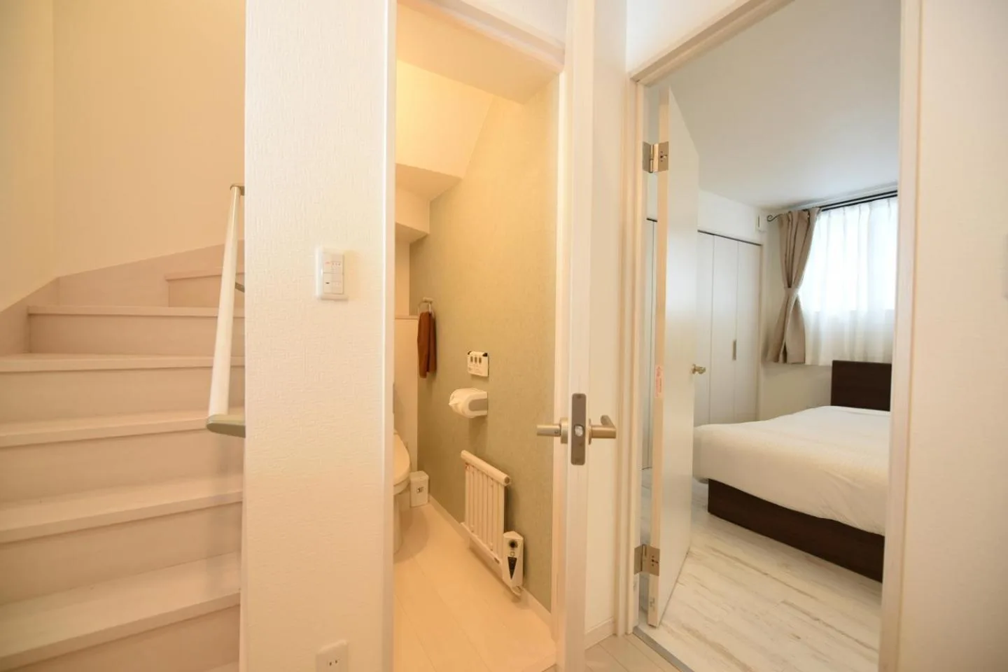 S12 HOTEL – Sapporo, Japan hotel – a small room with a bed and a staircase at S12 HOTEL in Sapporo