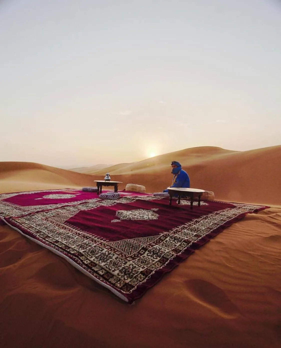 Desert picnic setup on the dunes near Sahara Tours luxury camp in Merzouga