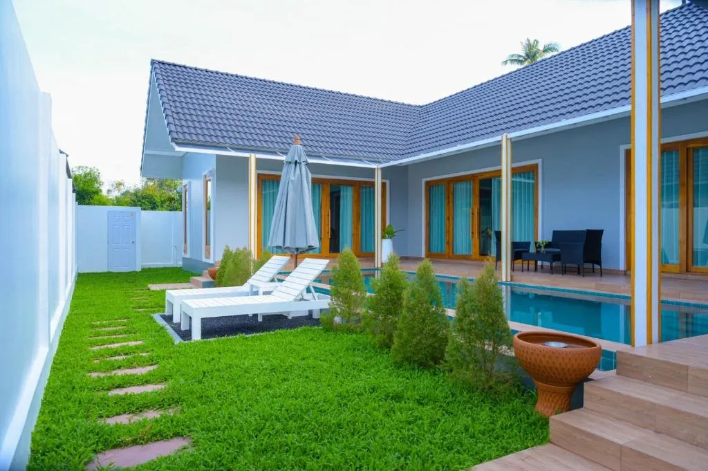 Samui Tropical Pool Villas garden with loungers