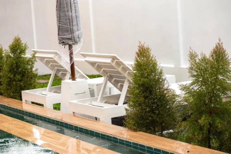 Lounge chairs by the pool at Samui Tropical Pool Villas