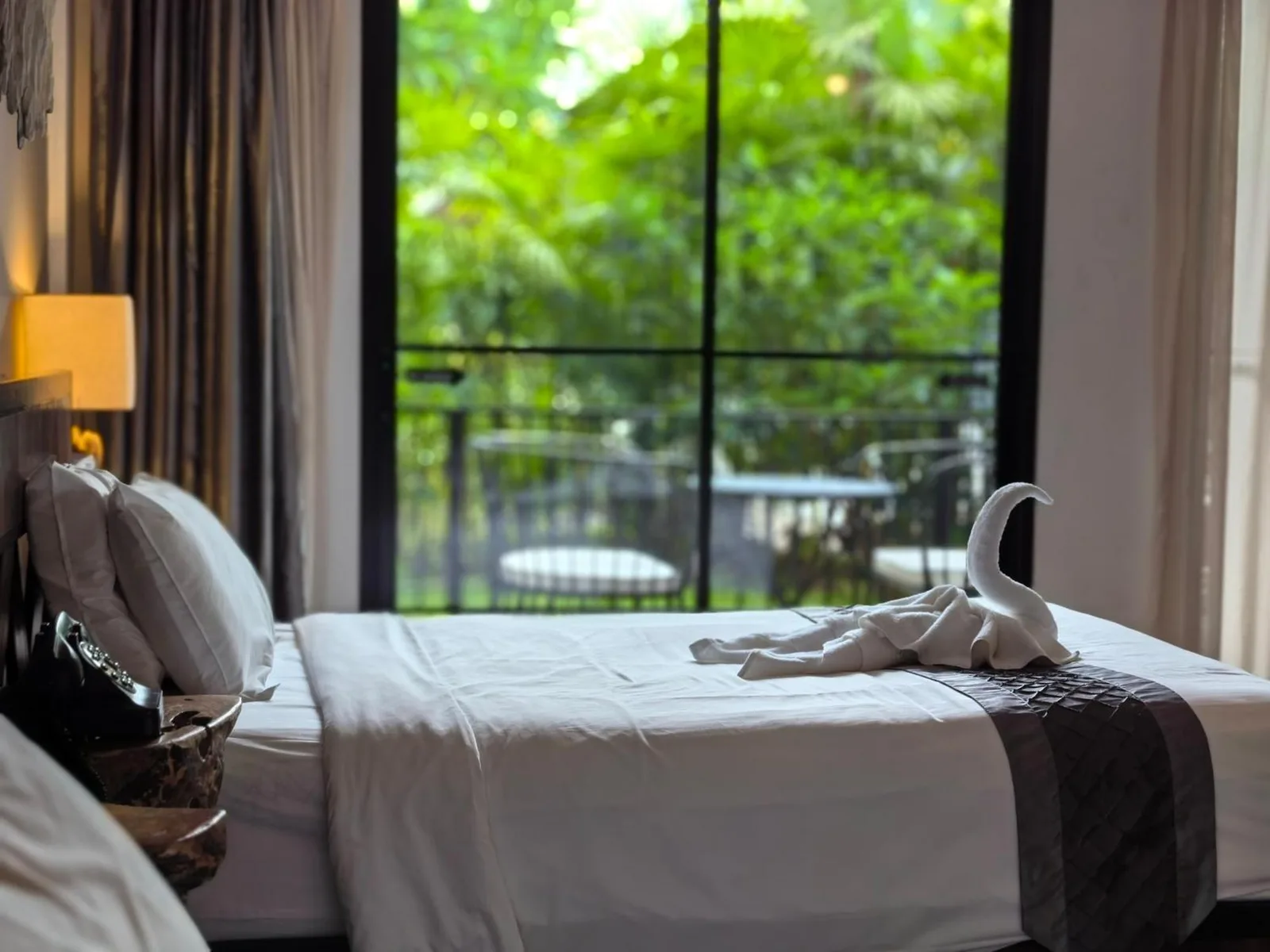 Bed with a view at Sannot Riverside Boutique Hotel in Chiang Mai