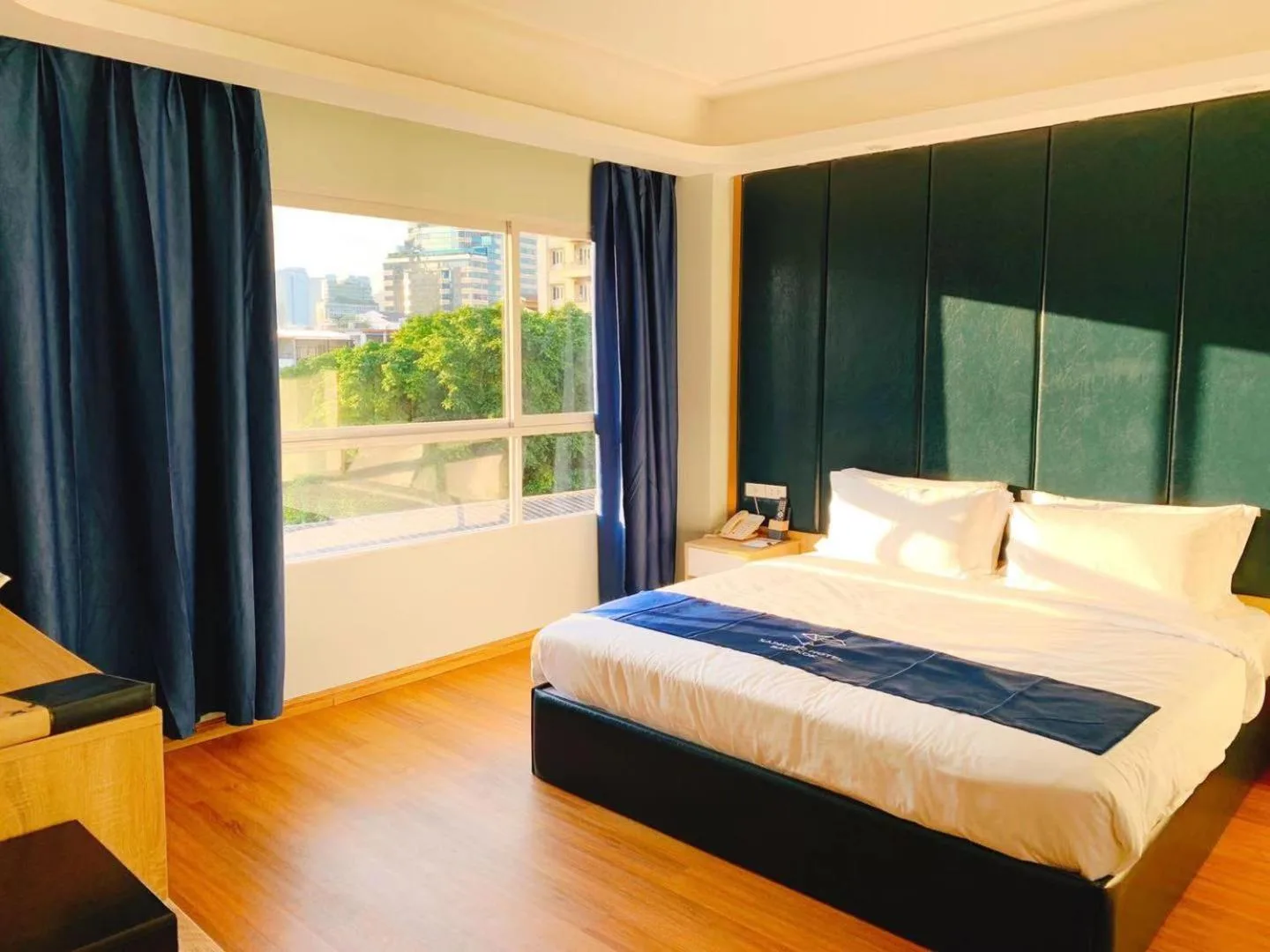 Sapphire Hotel Silom Bangkok – Bangkok, Thailand hotel – a bedroom with a large bed and a large window at Sapphire Hotel Silom Bangkok in Bangkok