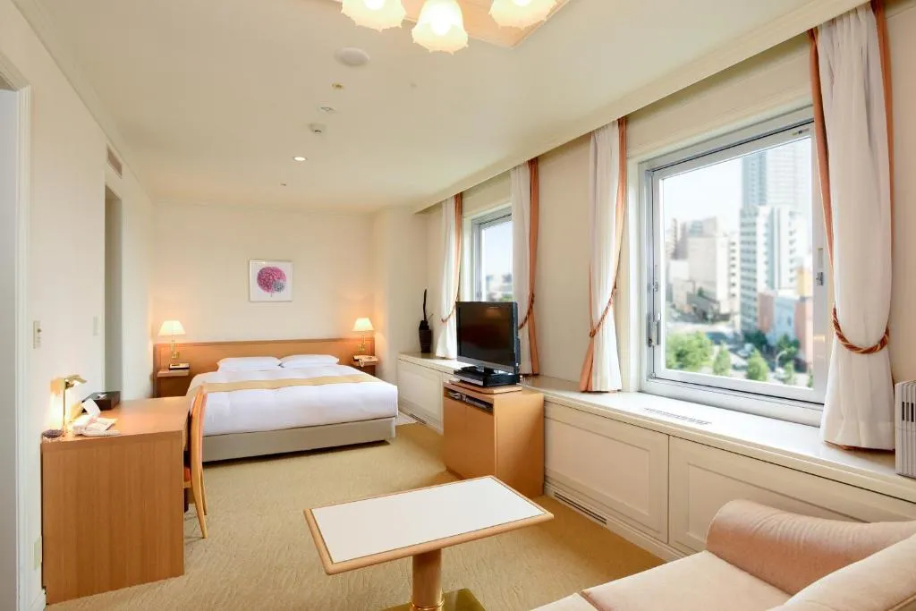 Sapporo Park Hotel standard room with bed and TV