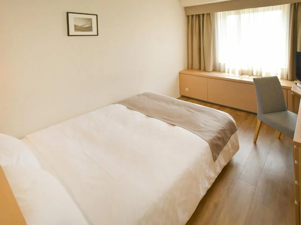 Cozy guest room at Sapporo View Hotel Odori Park with modern furnishings