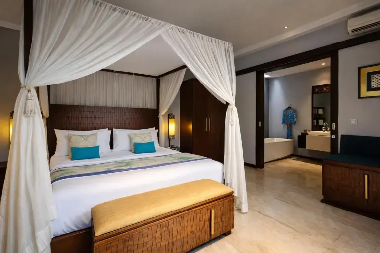 Bedroom and bathroom at Seminyak Icon by Karaniya Experience