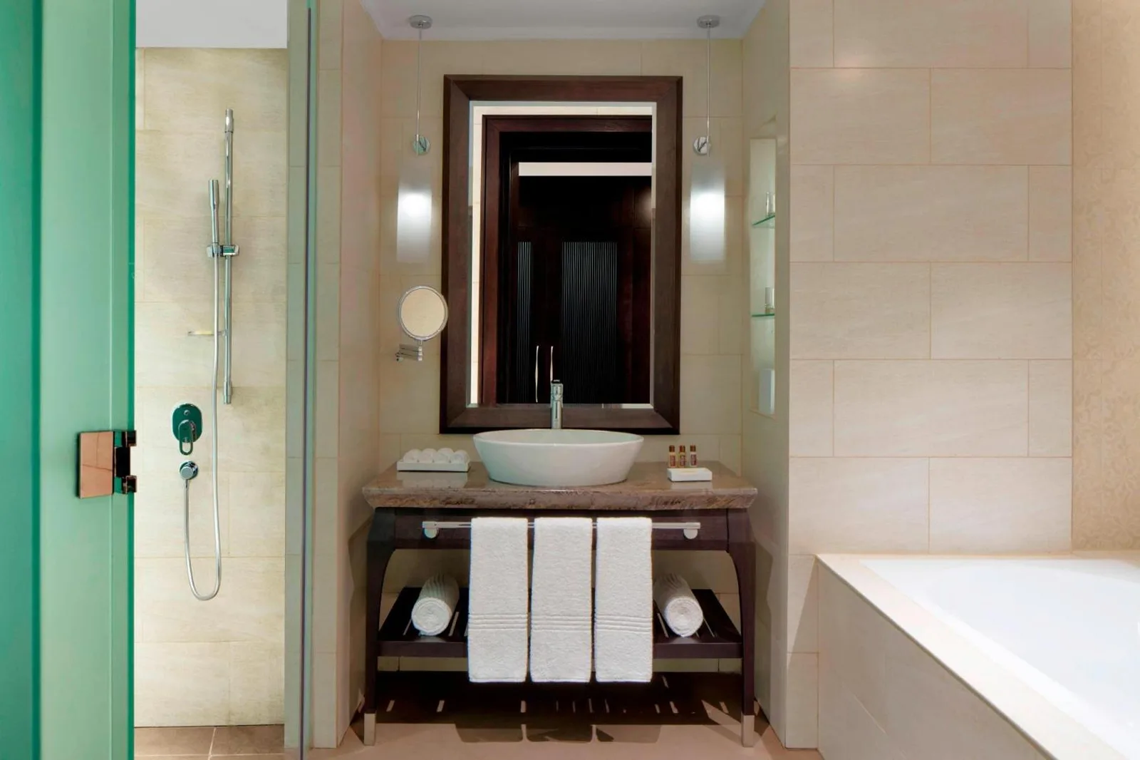 Modern bathroom at Sheraton Sharjah Beach Resort and Spa in Sharjah with walk-in shower and wall-mounted sink