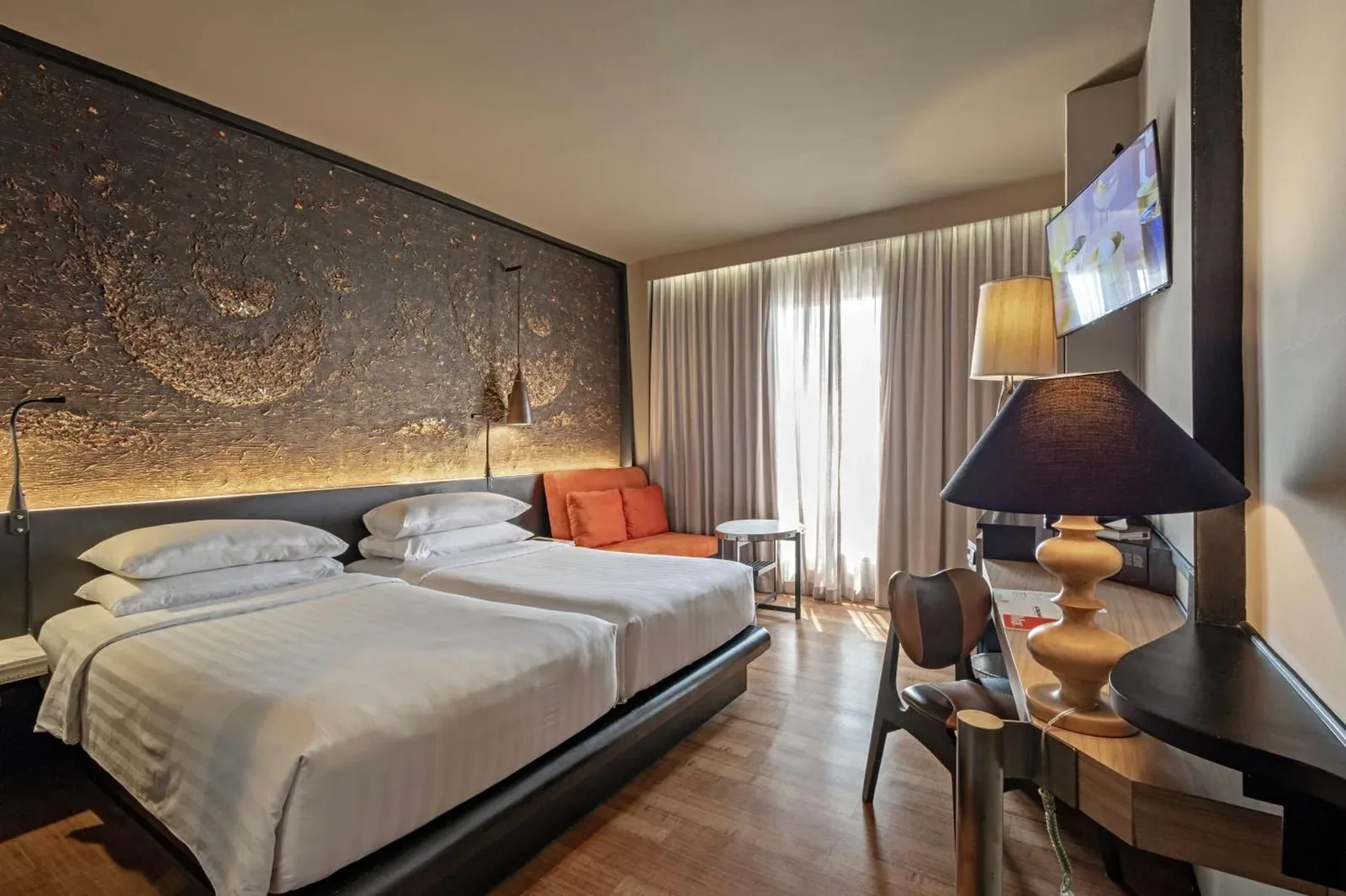 Cozy interior of a guest room at Siam At Siam Design Hotel Bangkok