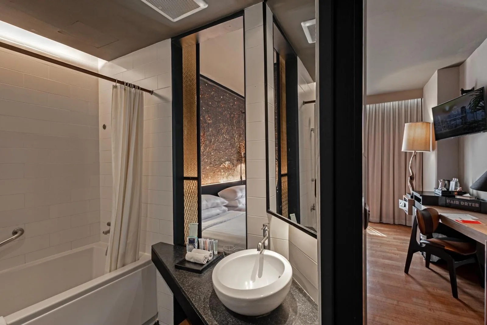 Elegant bathroom in a guest room at Siam At Siam Design Hotel Bangkok