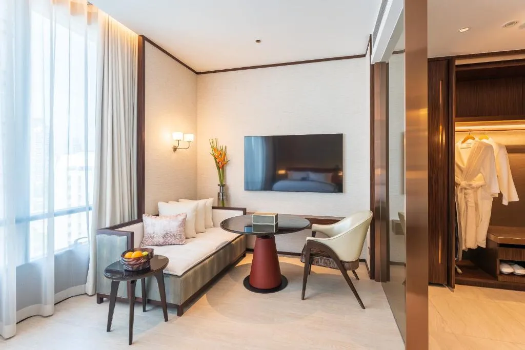 SILQ Hotel & Residence seating area with TV