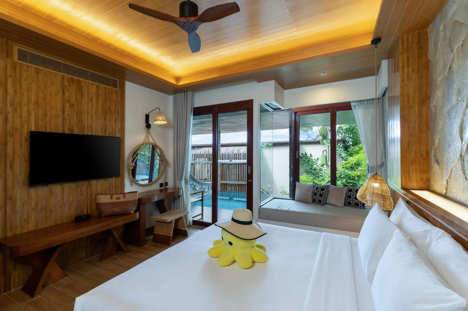 Interior of a Family Suite at SINAE Phuket Luxury Hotel with modern amenities.