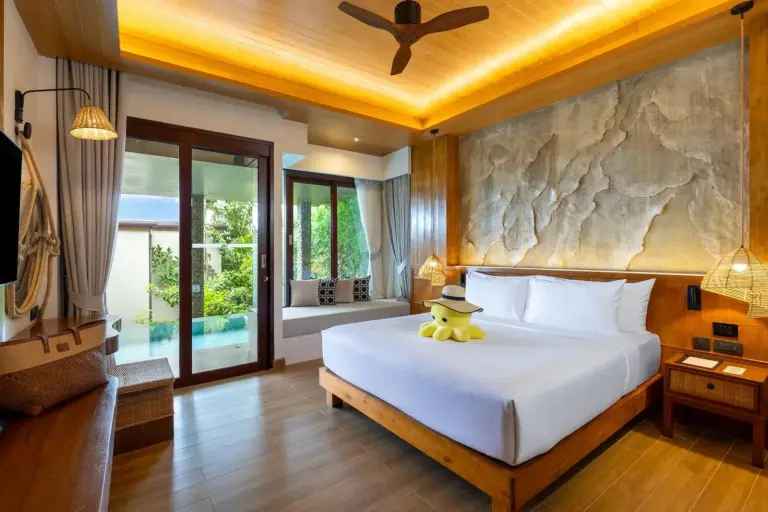 Poolside suite view at SINAE Phuket Luxury Hotel.