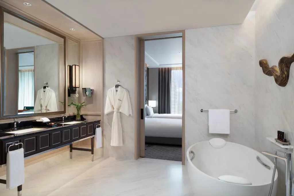 Stylish bathroom with bathtub at Sindhorn Kempinski Hotel Bangkok