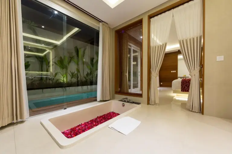 Sithala Villa Seminyak elegant bathroom with view of pool
