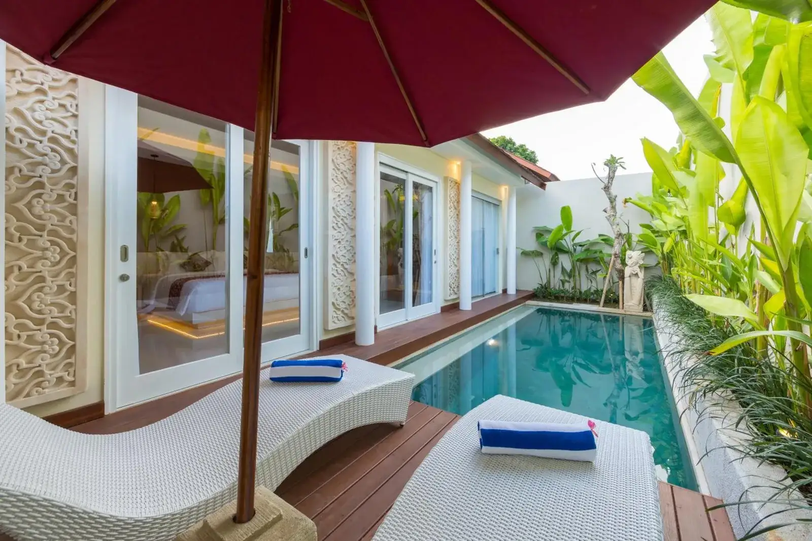 Sithala Villa Seminyak private pool area with lounging chairs