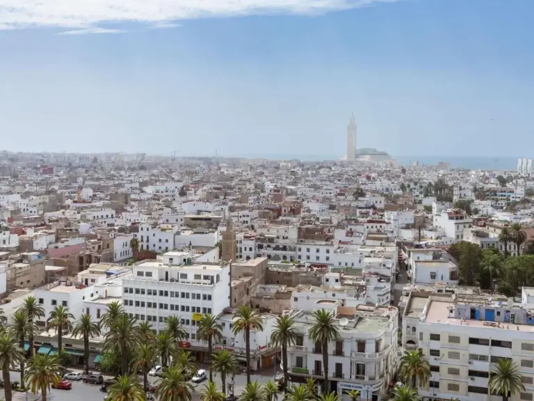 Sofitel Casablanca Tour Blanche – Casablanca, Morocco hotel – a hotel room with a bed and a couch and chairs at Sofitel Casablanca Tour Blanche in Casablanca