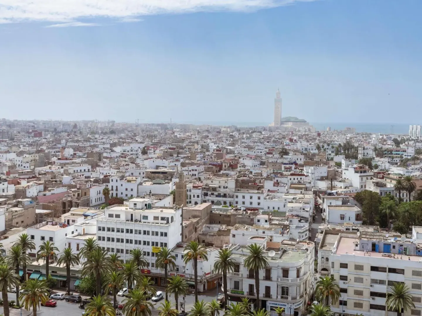 Sofitel Casablanca Tour Blanche – Casablanca, Morocco hotel – a hotel room with a bed and a couch and chairs at Sofitel Casablanca Tour Blanche in Casablanca
