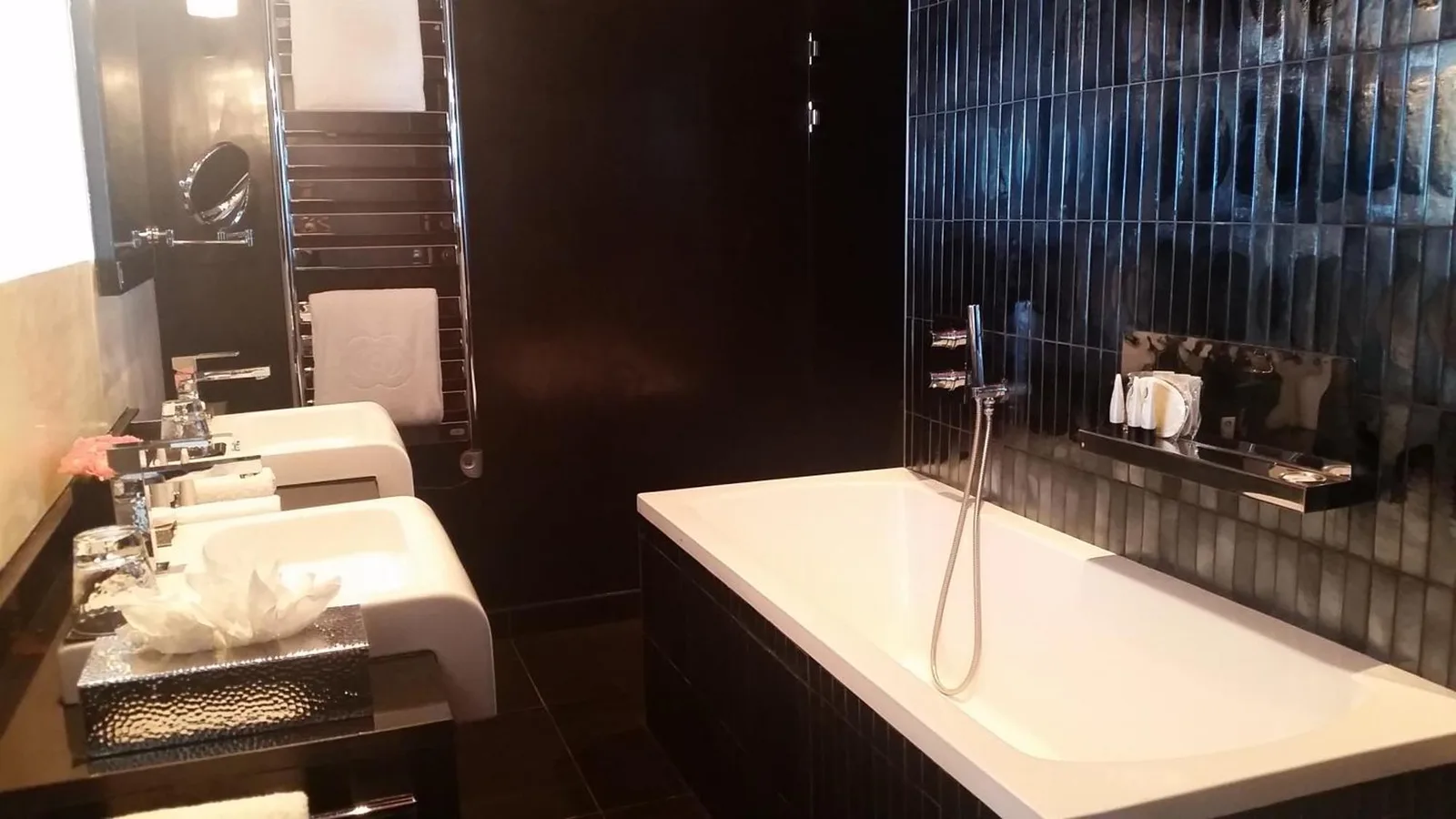 Sofitel Casablanca Tour Blanche – Casablanca, Morocco hotel – four bottles of moisturizers are sitting on a shelf at Sofitel Casablanca Tour Blanche in Casablanca