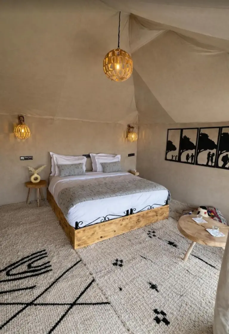 Starlit Luxury Camp serene bedroom with natural decor