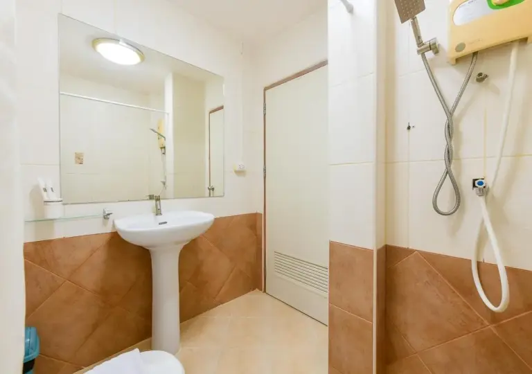 Sun & Beach Pattaya bathroom sink area with pedestal basin and shower