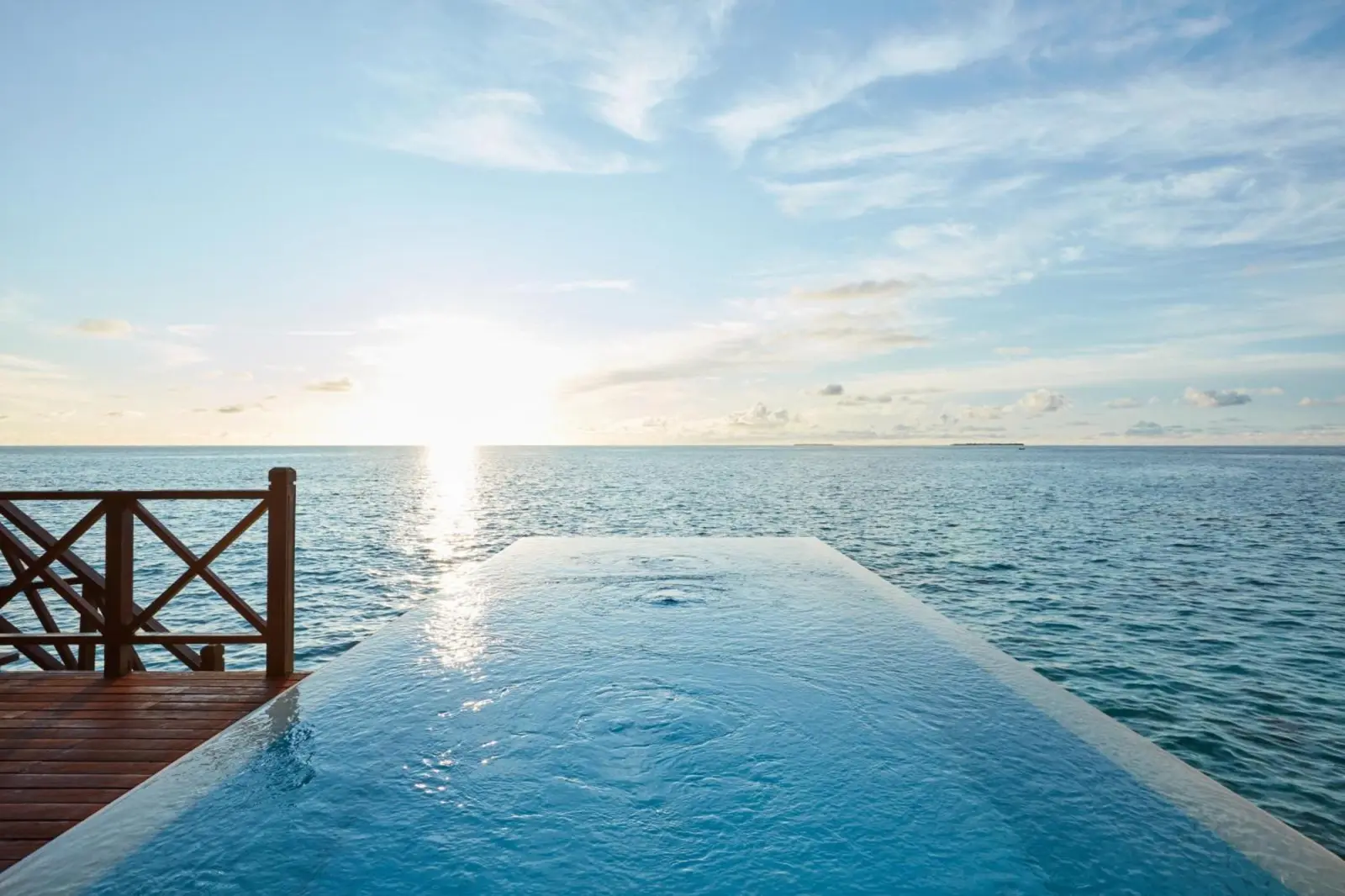 Sunset view from infinity pool at Sun Siyam Vilu Reef
